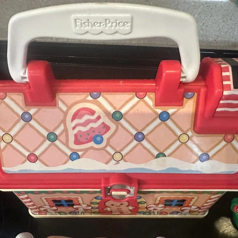 Vintage Fisher Price Christmas playset with Santa, reindeer, and gingerbread